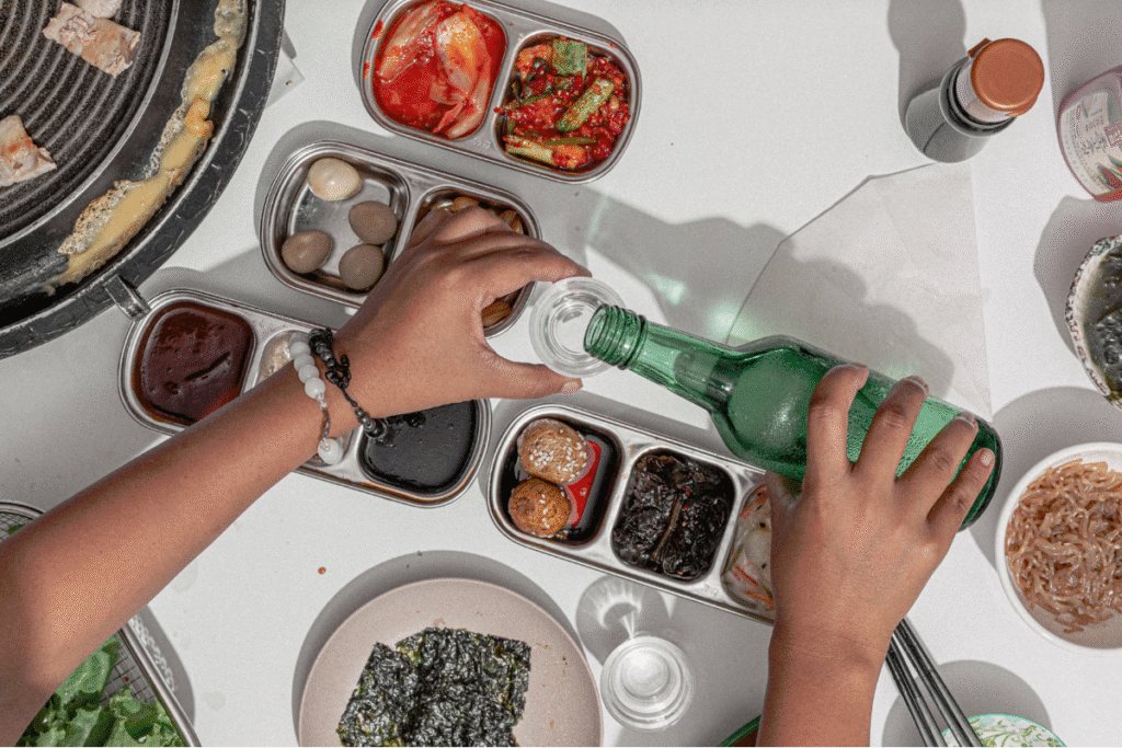 menikmati minuman soju dan kudapan khas korea